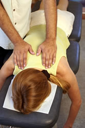 doctor hands on patient back