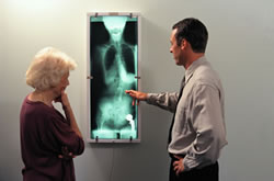 doctor shows patient x-rays